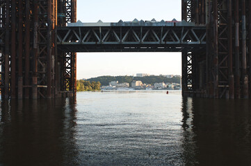 Unfinished bridge in Ukraine. Metal constructions. Dnieper river in Kyiv. Urban town.