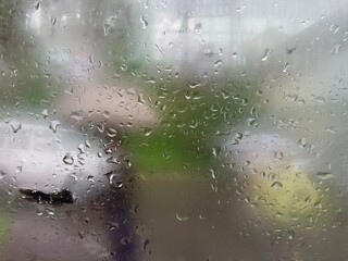 Water drops on the glass,Concept of driving in rain, bad driving conditions, selective focus.