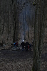 people camping in the woods during cold days