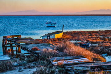Seascape view from an old pier at sunset