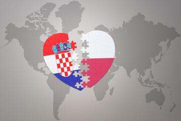 puzzle heart with the national flag of croatia and poland on a world map background.Concept.