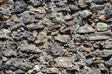 very old stone wall with various material, background, texture