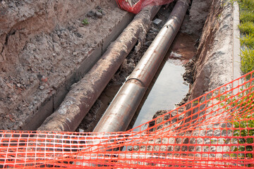 Repair of the heating plant system with the laying of new underground metal pipes in the trench....