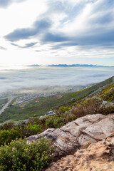 The southern suburbs of Cape Town from silvermine, covered in fog down below.