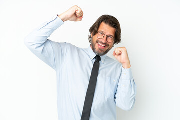 Senior dutch business man isolated on white background celebrating a victory