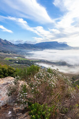 Naklejka na ściany i meble The southern suburbs of Cape Town from silvermine, covered in fog down below.