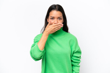 Young Colombian woman isolated on white background covering mouth with hand