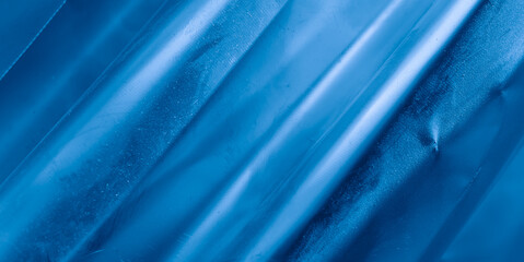 scratched blue metal sheet with visible texture. background