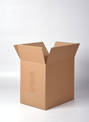 brown cardboard box sealed with adhesive tape on a white background