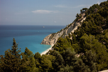 lefkas cliffs in greece with many trees by the sea coastline