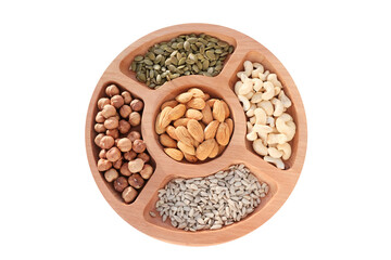Mix of nuts, hazelnuts, cashews, seeds, peanuts. In a wooden plate, isolated object. The concept of healthy eating, vegetarianism.