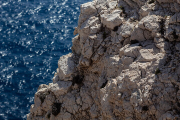 beautiful rock in the sea during sunny day