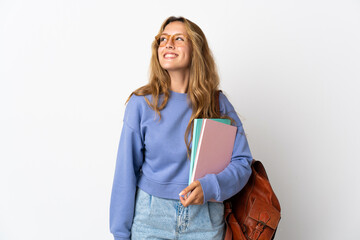 Young student woman isolated on white background thinking an idea while looking up