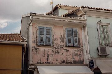 old retro vintage house with colorful windows in lefkas town greece