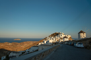 View over famous windmills and Chora town with traditional style white houses on Serifos island in Greece