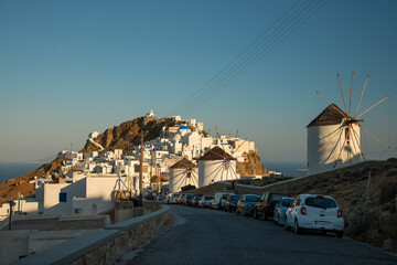 View over famous windmills and Chora town with traditional style white houses on Serifos island in Greece