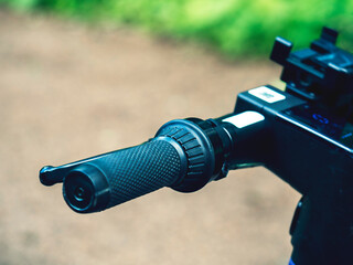 Close-up of the handlebars of an electric scooter.