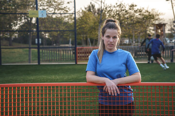 female soccer player on a soccer field. Rights of women soccer player