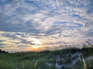 Beach Cloudy Sunrise Over Seagrass