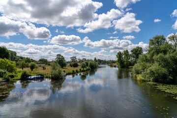 Reflection of clouds on a river, outdoor summer holiday, hiking in the countryside