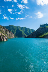 Obraz premium Komani Lake ferry cruise boat view near the town of Fierz, Albania. Komani Lake is a popular tourist destination in Albania. 