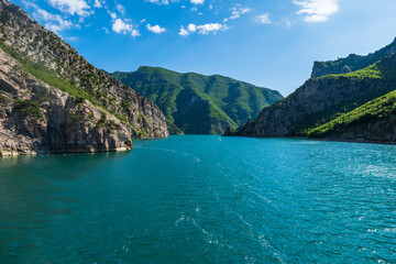 Komani Lake ferry cruise boat view near the town of Fierz, Albania. Komani Lake is a popular tourist destination in Albania. 