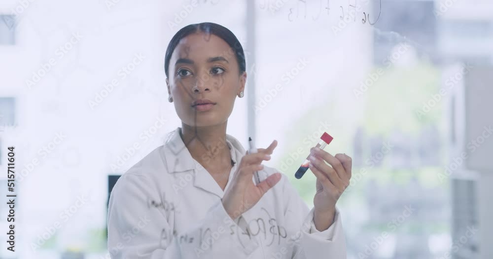 Poster female scientists writing formula on a clear glass board and holding a blood sample in a medical res