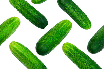 green cucumbers on a white background. ripe gherkins on a table. fresh vegetables on a light texture. the concept of growing cucumbers