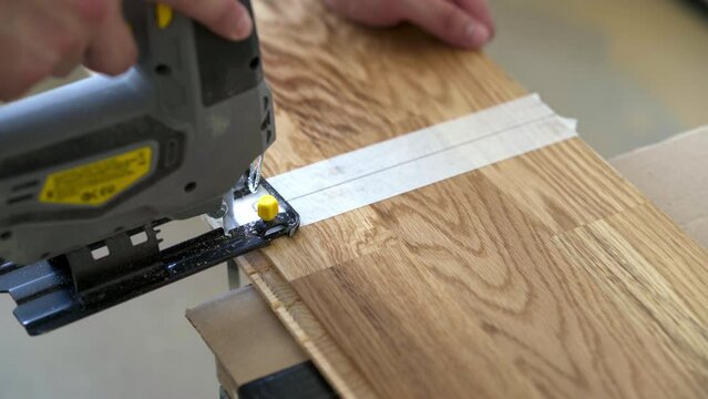	Cutting Parquet Floor Board With Jigsaw