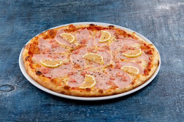 fresh pizza on the white plate