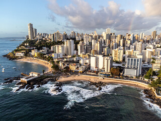 Fototapeta premium Tip of Salvador with beautiful sunset lighting in a large coastal city with beach, Bahia, Brazil
