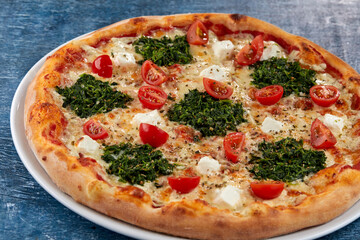 fresh pizza on the white plate
