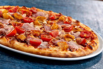 fresh pizza on the white plate