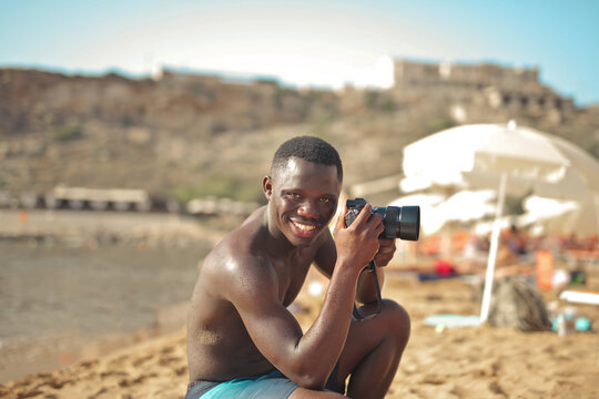 young photographer at the beach