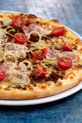 fresh pizza on the white plate