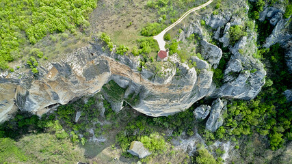 Aerial photography from a drone. Top view of a gazebo on the edge of a cliff in the mountains