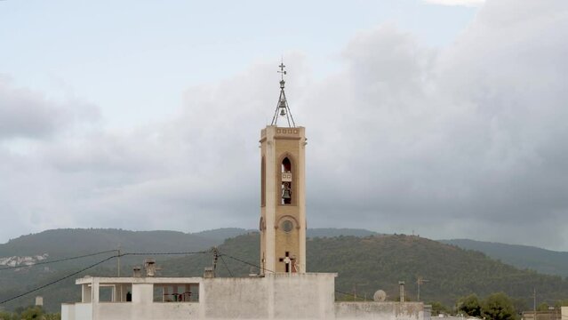 Time lapse, Bell tower with cloudy sky background.