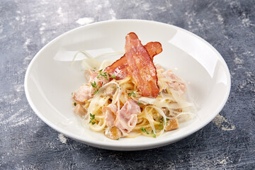 Spaghetti carbonara with bacon and cheese