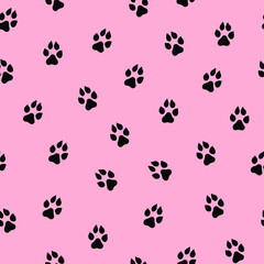 Fototapeta na wymiar Seamless vector pattern with cute cat or dog paws. Animal footprint on pink background.
