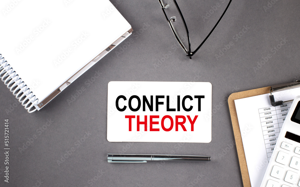 Poster conflict theory . text written on the card with notebook and clipboard, grey background