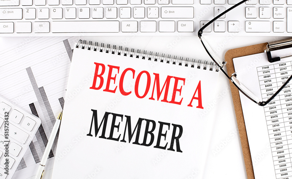 Poster text become a member on office desk table with keyboard, notepad and analysis chart on white backgro