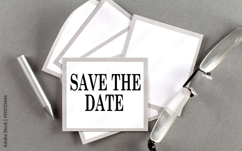 Poster save the date text written on a sticky with pencil and glasses