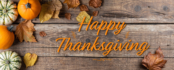 Happy Thanksgiving. Thanksgiving background with pumpkins and autumn leaves on rustic wooden...