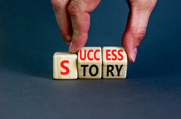 Success story symbol. Concept words Success story on wooden cubes. Businessman hand. Beautiful grey...