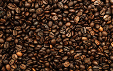 Close-up of roasted brown coffee beans background
