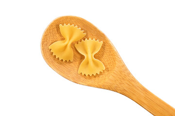 Wooden spoon with pasta isolated on white background.