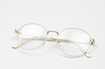 Stylish eyeglasses on a white background. Iron frame glasses