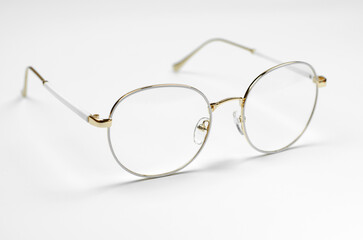Stylish eyeglasses on a white background. Iron frame glasses
