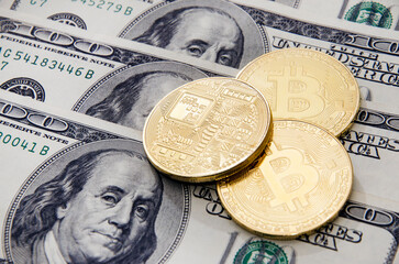 Golden bitcoins and dollars banknotes