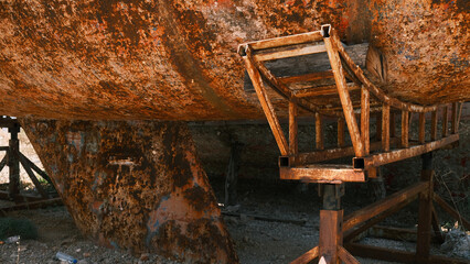 Rusty body and keel of sailing yacht before repair